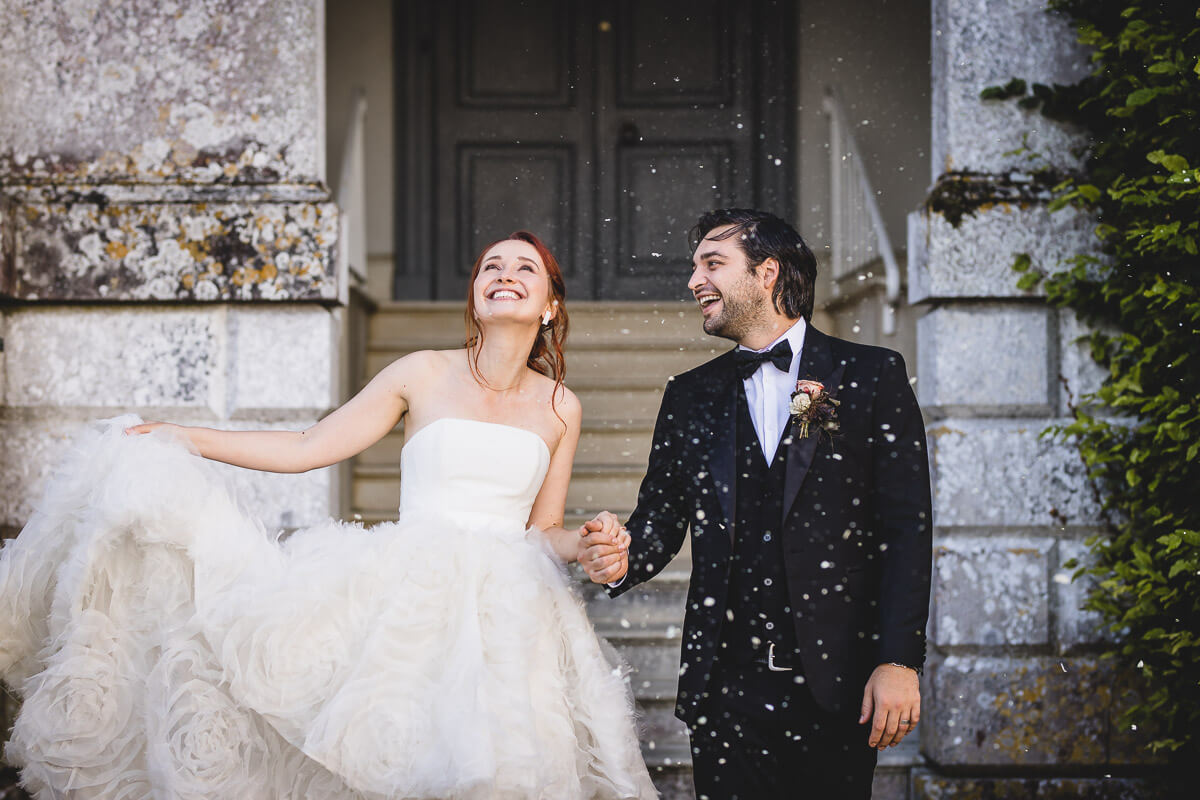 Bride and Groom being showered in confetti at Came House, Dorchester